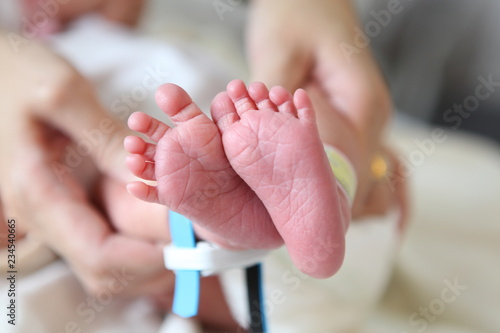 Newborn feet. baby and medical concept photo
