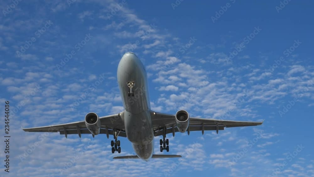 Epic slow motion shot of commercial jet coming into land. Airbus A330-343. Pearson International Airport, Toronto, Canada. No logos visible. Epic slow motion shot of commercial jet coming into land. Airbus A330-343. Pearson International Airport, Toronto, Canada. No logos visible.
