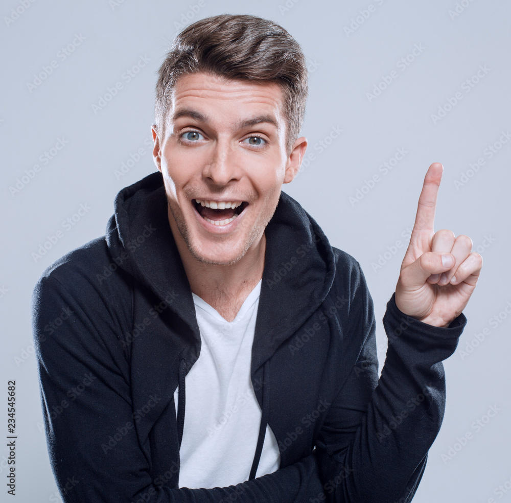 Fototapeta premium surprised handsome man pointing copy space