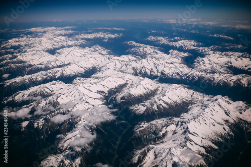 view from airplane window to the mountains