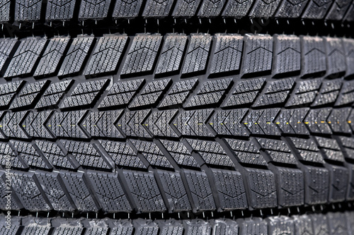Close-up winter tire tread; soft rubber wheel for riding in snow.