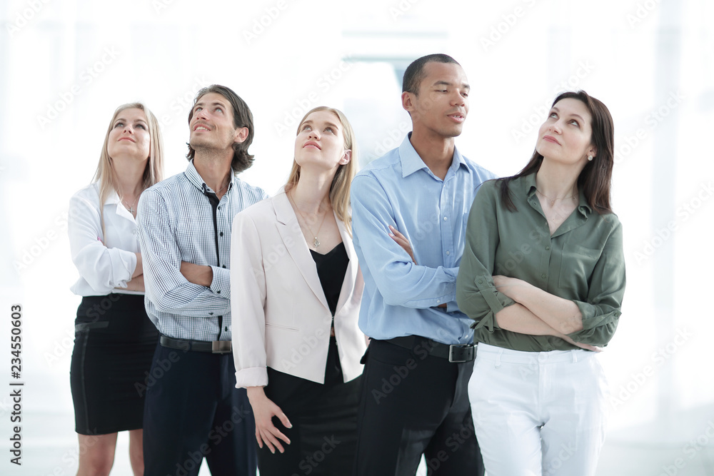 young business team looking up at copy space. young business team looking up at copy space.