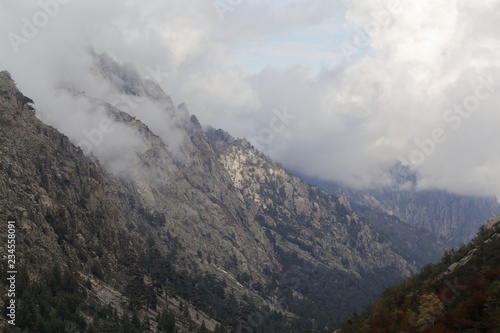 Mountains with clouds in the Restonica valley in Corsica