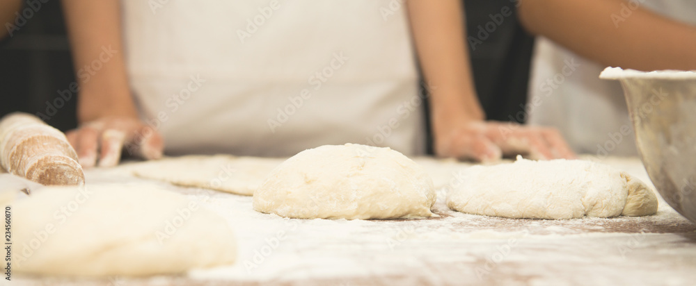 Young children make dough products. Hands closeup Young children make dough products. Hands closeup