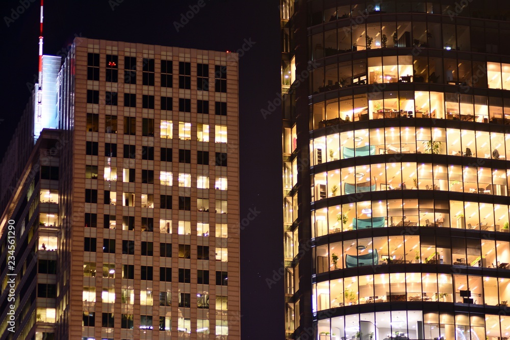 Obraz premium Modern office building at night. Night lights, city office building downtown, cityscape view