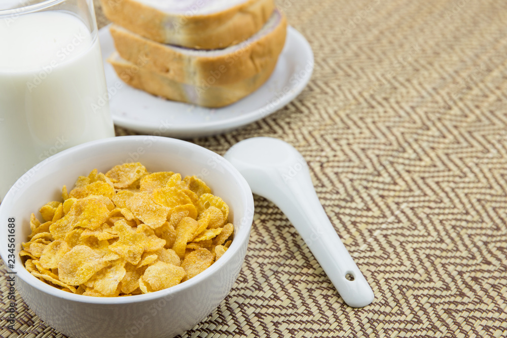 healthy breakfast: cornflakes with milk and bread