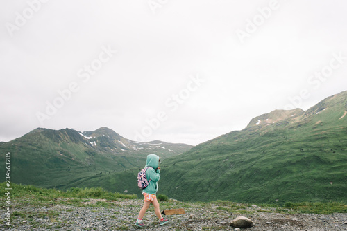Young child walking through a field