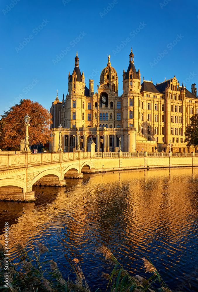 Schwerin Palace with castle bridge in autumn. Germany