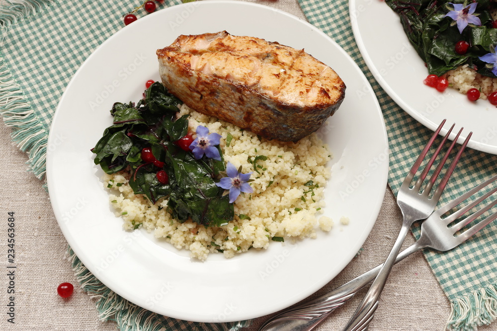 Grilled salmon with couscous and braised chard. Grilled salmon with couscous and braised chard.