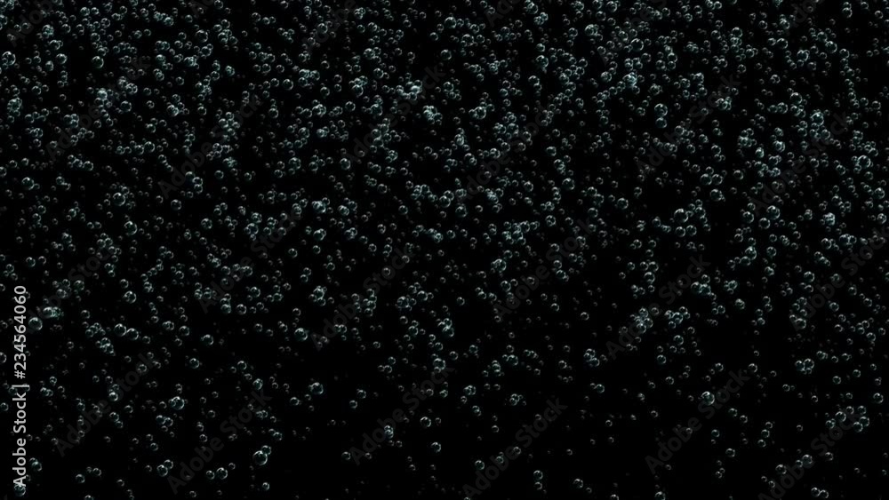 A large number of bubbles rise up.Depth of field.Bubbles rising up. Boiling water, closeup A large number of bubbles rise up.Depth of field.Bubbles rising up. Boiling water, closeup