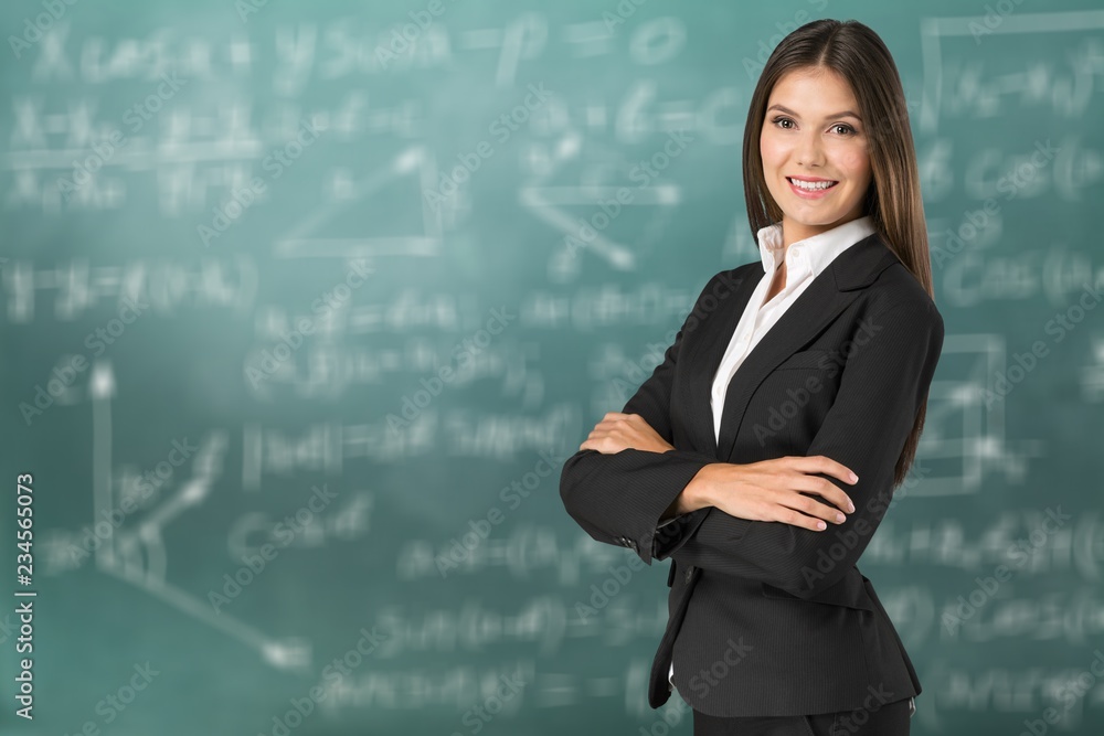 Young businesswoman in suit on blurred office interior Young businesswoman in suit on blurred office interior