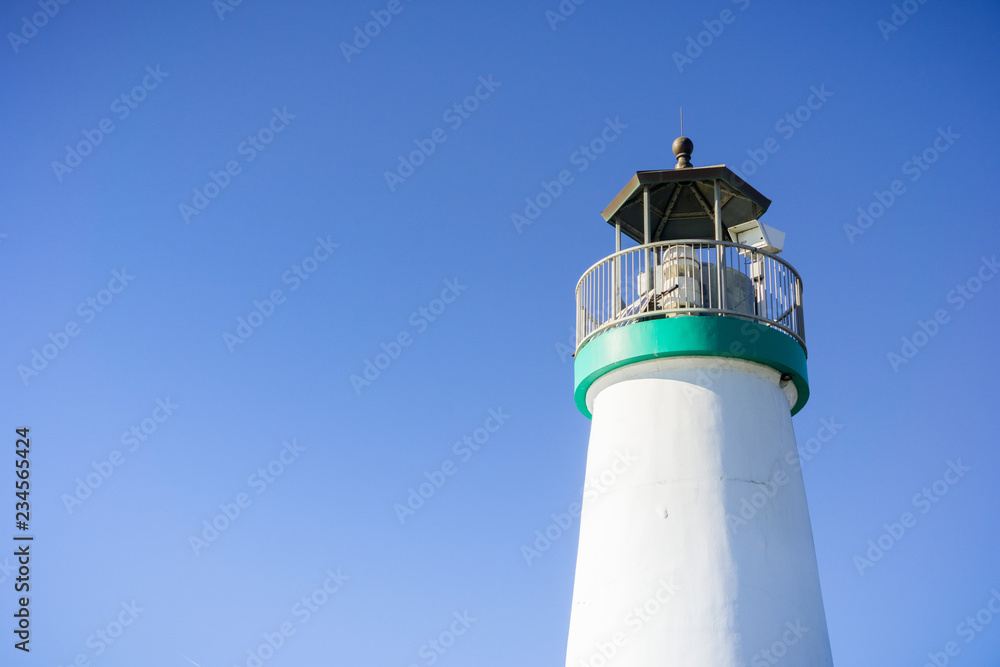 Top of the Santa Cruz Breakwater Lighthouse, Walton Lighthouse, Santa Cruz, California; blue sky background