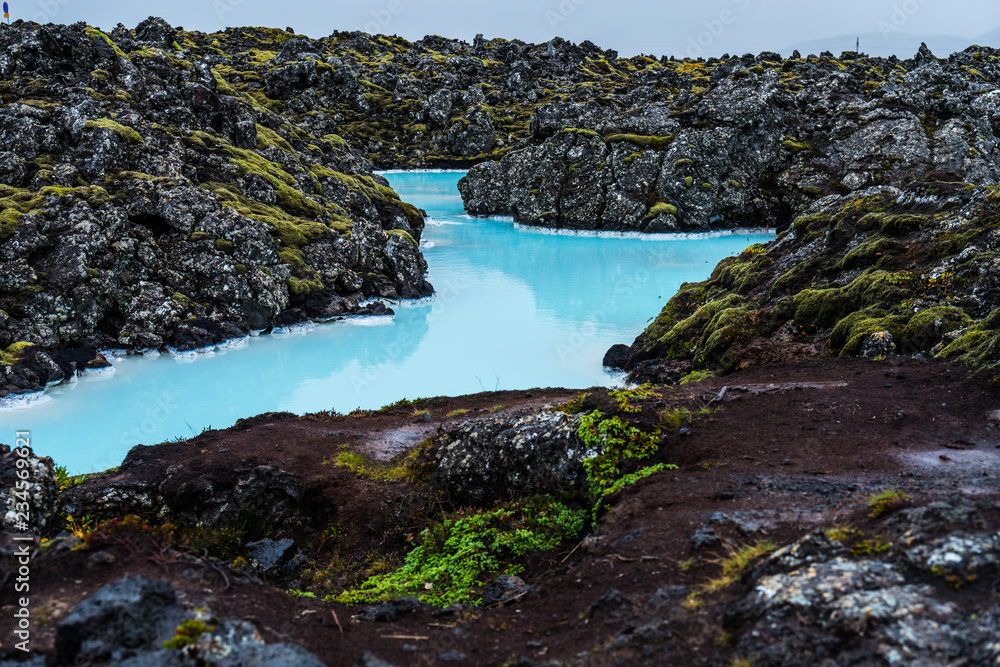 Iceland landscape near blue lagoon - lava rock and lagoon water