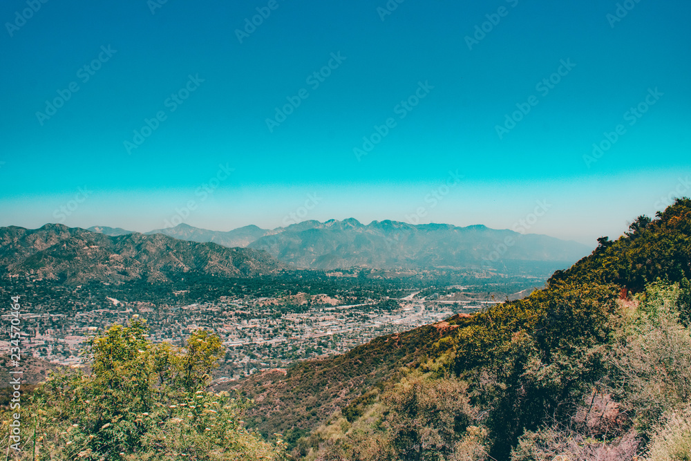 View of City Beneath Mountains