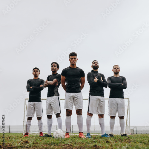 Soccer players standing on the field during practice © Jacob Lund