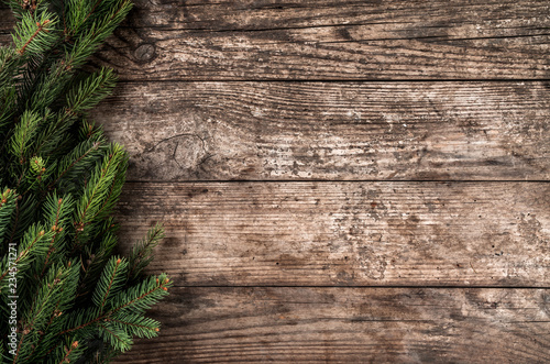 Christmas fir branches on wooden background. Xmas and New Year theme. Flat lay  top view