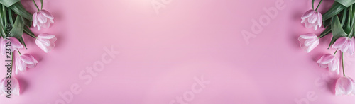Pink tulips flowers on pink background. Waiting for spring. Happy Easter card. Flat lay, top view © Jukov studio