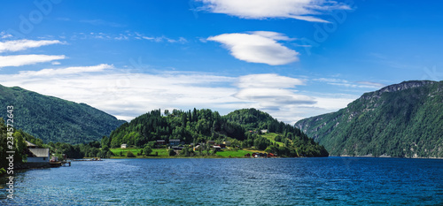 Scenic summer view of the Staursetbukta bay and Grovahaugen hill in the county of More og Romsdal, Norway. Norwegian sea bay in summer scenery