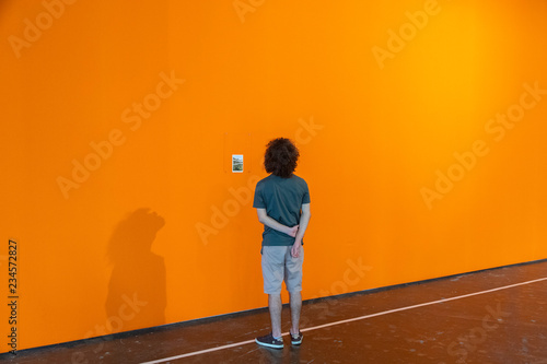man in front of wall