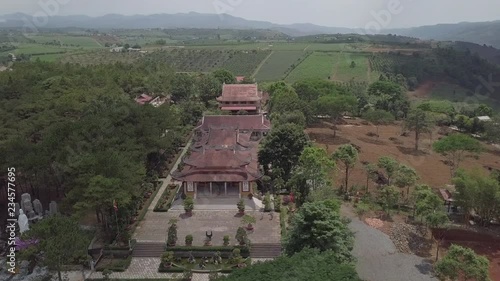 2K Aerial top view of an old asian temple in Bao Loc Vietnam among tea plantations. Zen buddhist temple in Vietnam. 
