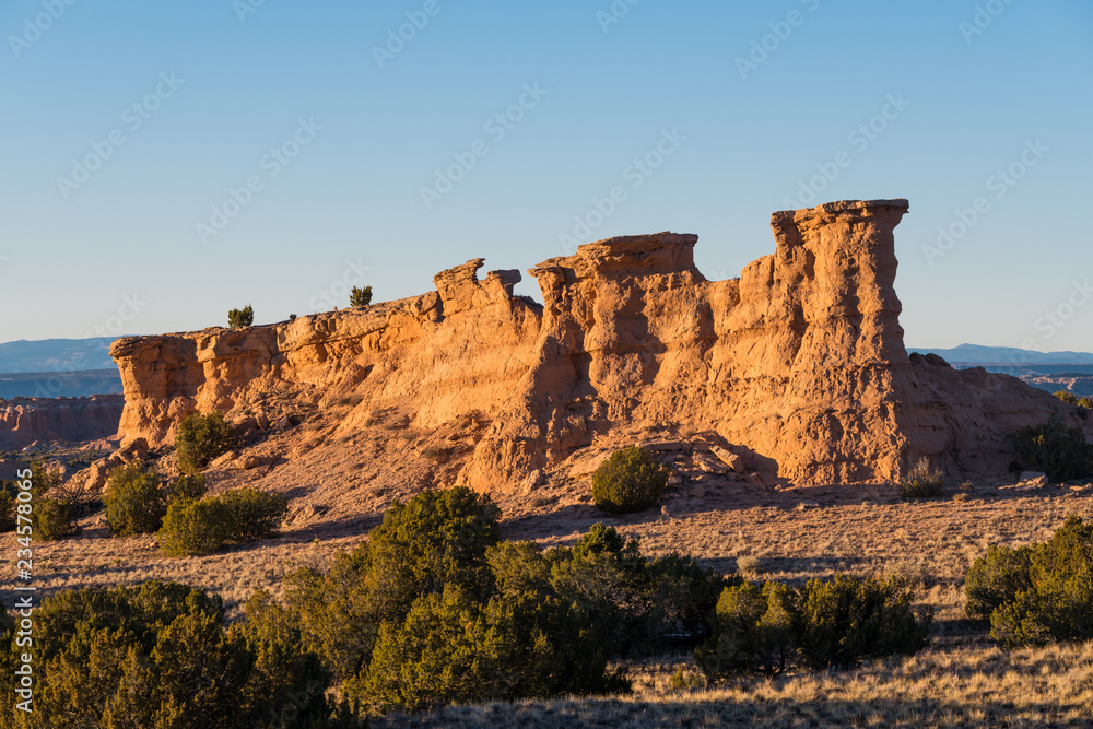 Sandstone red rock formation glowing in the golden light of sunset  near Santa Fe, New Mexico