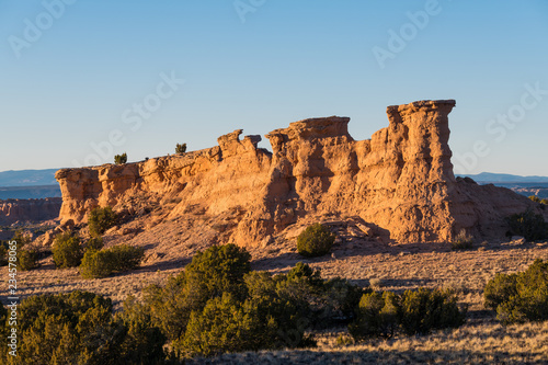 Sandstone red rock formation glowing in the golden light of sunset near Santa Fe, New Mexico