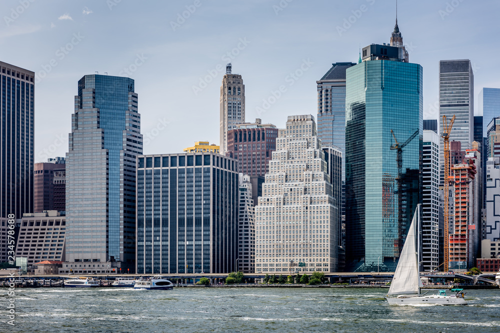 Sailing On New York City's East River Along the Skyline of Lower Manhattan