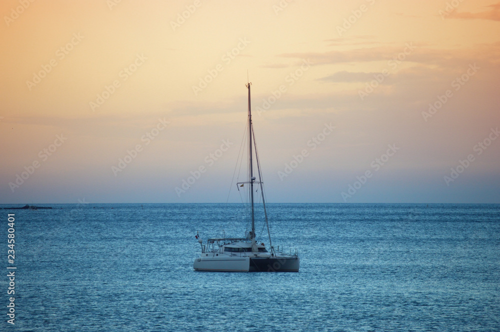 Ship sailing in the Mediterranean at sunset