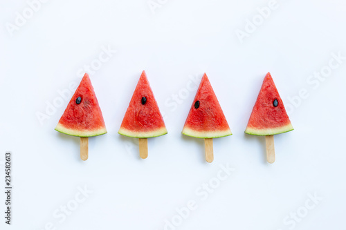 Sweet watermelon slice popsicles on white background