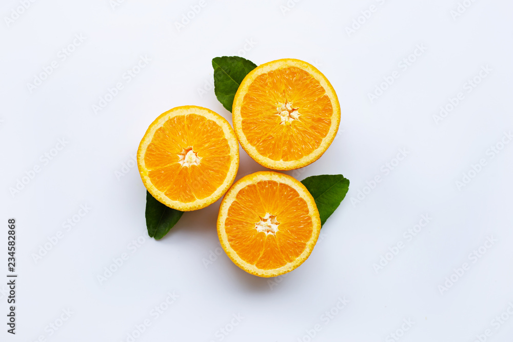 Fresh orange citrus fruit with leaves isolated on white wooden background.  Top view