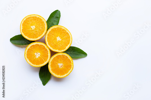 Fresh orange citrus fruit with leaves isolated on white wooden background.  Copy space
