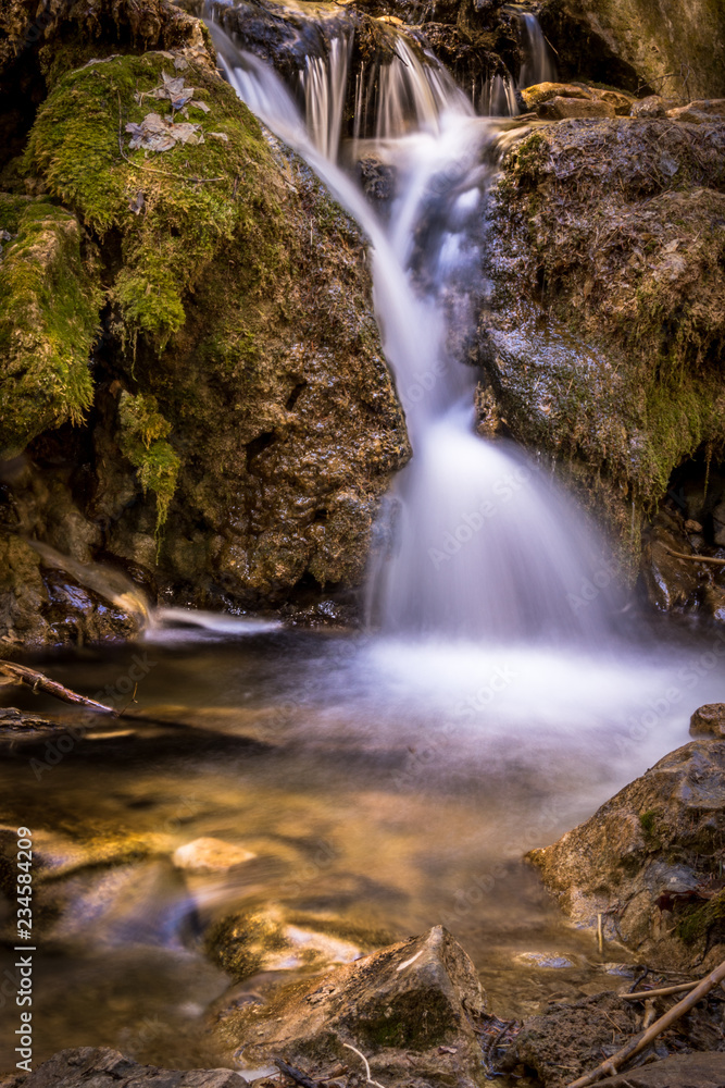 Fototapeta premium Long Exposure of Mountain Stream Water Fall