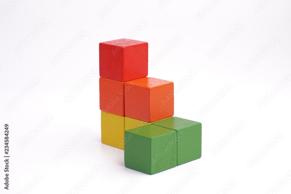 Colorful wooden cube isolated on white background. Colorful wooden cube isolated on white background.
