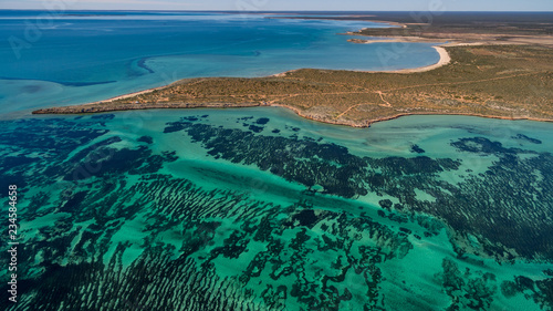 Oblique aerial drone view of seagrass meadows and headlands in the World Heritage Listed Shark Bay Conservation Area.
