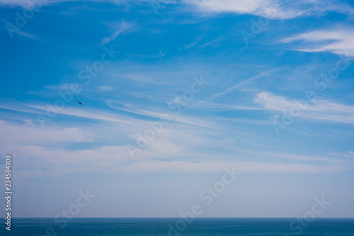 View of sky and sea with the horizon a summer day.