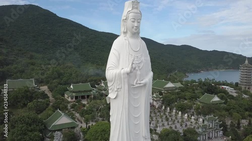 2K Aerial view Lady Buddha close-up Da Nang Vietnam. Big white buddha statue top view. Linh Ung pagoda in Danang city. 