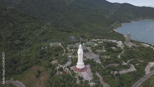 2K Aerial View of White Big Buddha in Da Nang Vietnam. Lady Buddha statue top view. Linh Ung pagoda in Danang Vietnam. 