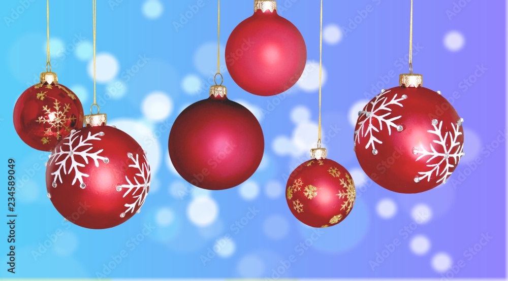 Red shiny decorative Christmas balls on white background