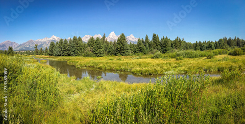 Panoramic of River with Grand Tetons in the Background