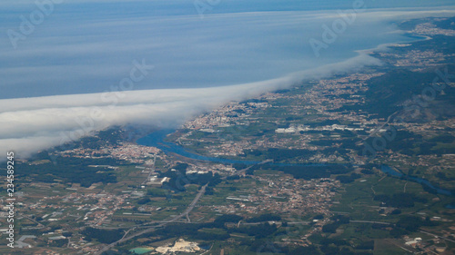  Aerial shot from plane over Braga district in Portugal showing cities of Esposende, Apulia and Fao and the Cavado river