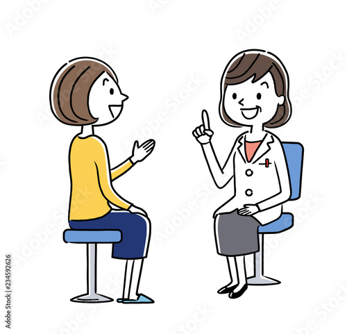 診察：女性医師と若い女性
