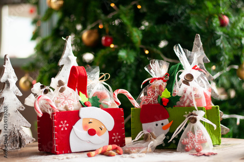 Christmas and New year gifts and baskets with sweets, alcohol, chocolate and cookies