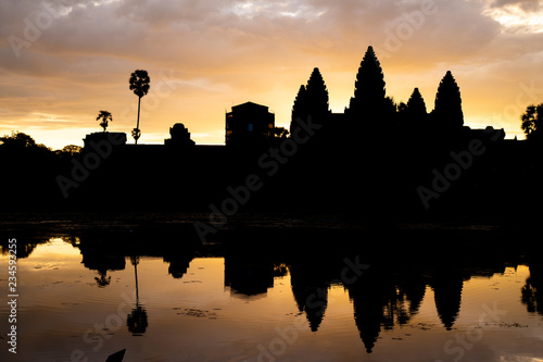 Golden sky form Sunrise view of ancient temple complex at entrance of Angkor Wat in Siem Reap, Cambodia the World Heritage (one of Seven Wonders of the Word).