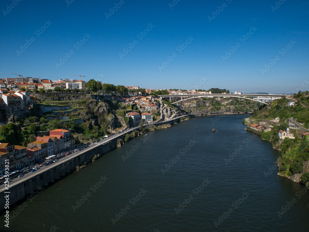 View along the Douro River in Porto, Portugal over Douro valley on a sunny summer day with blue sky