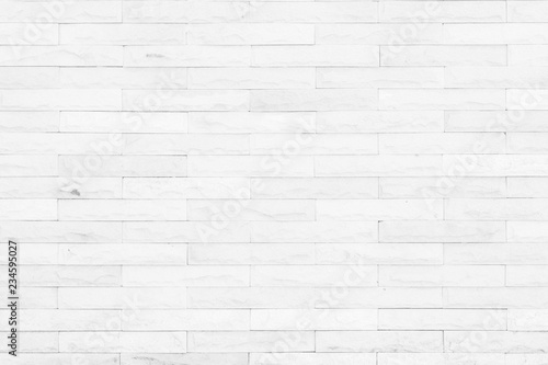 Seamless Grey pattern of decorative brick sandstone wall surface with concrete of modern style design decorative uneven have cracked realmasonry wall of multicolored stones or blocks with cement.