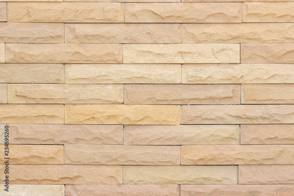 Seamless Grey pattern of decorative brick sandstone wall surface with concrete of modern style design decorative uneven have cracked realmasonry wall of multicolored stones or blocks with cement. Seamless Grey pattern of decorative brick sandstone wall surface with concrete of modern style design decorative uneven have cracked realmasonry wall of multicolored stones or blocks with cement.