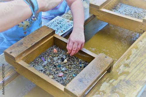 Outdoor kid activity searching for Gems and Gold photo