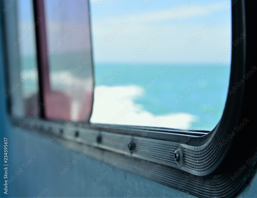 Fototapeta premium window opening to caribbean vacation