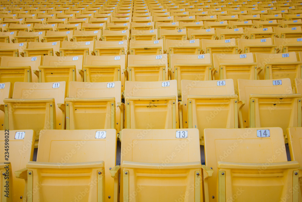 Fototapeta premium Yellow seats at the stadium
