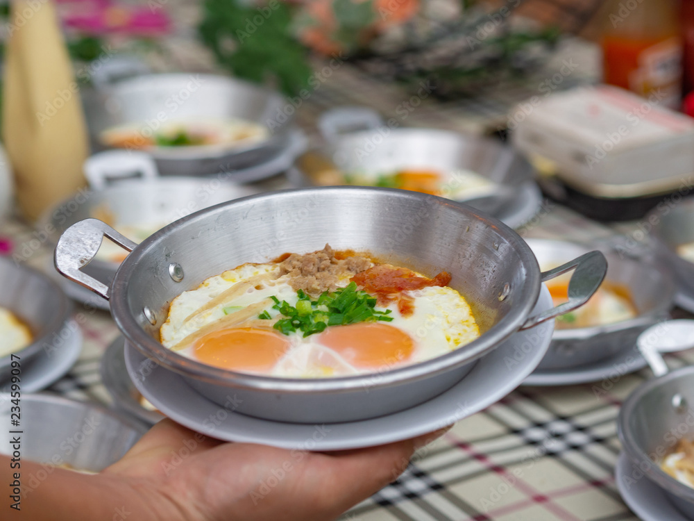Breakfast with fried eggs in a pan. Breakfast with fried eggs in a pan.